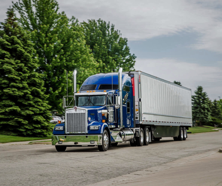 HYWAY Blue Temperature-Controlled truck drives down the road